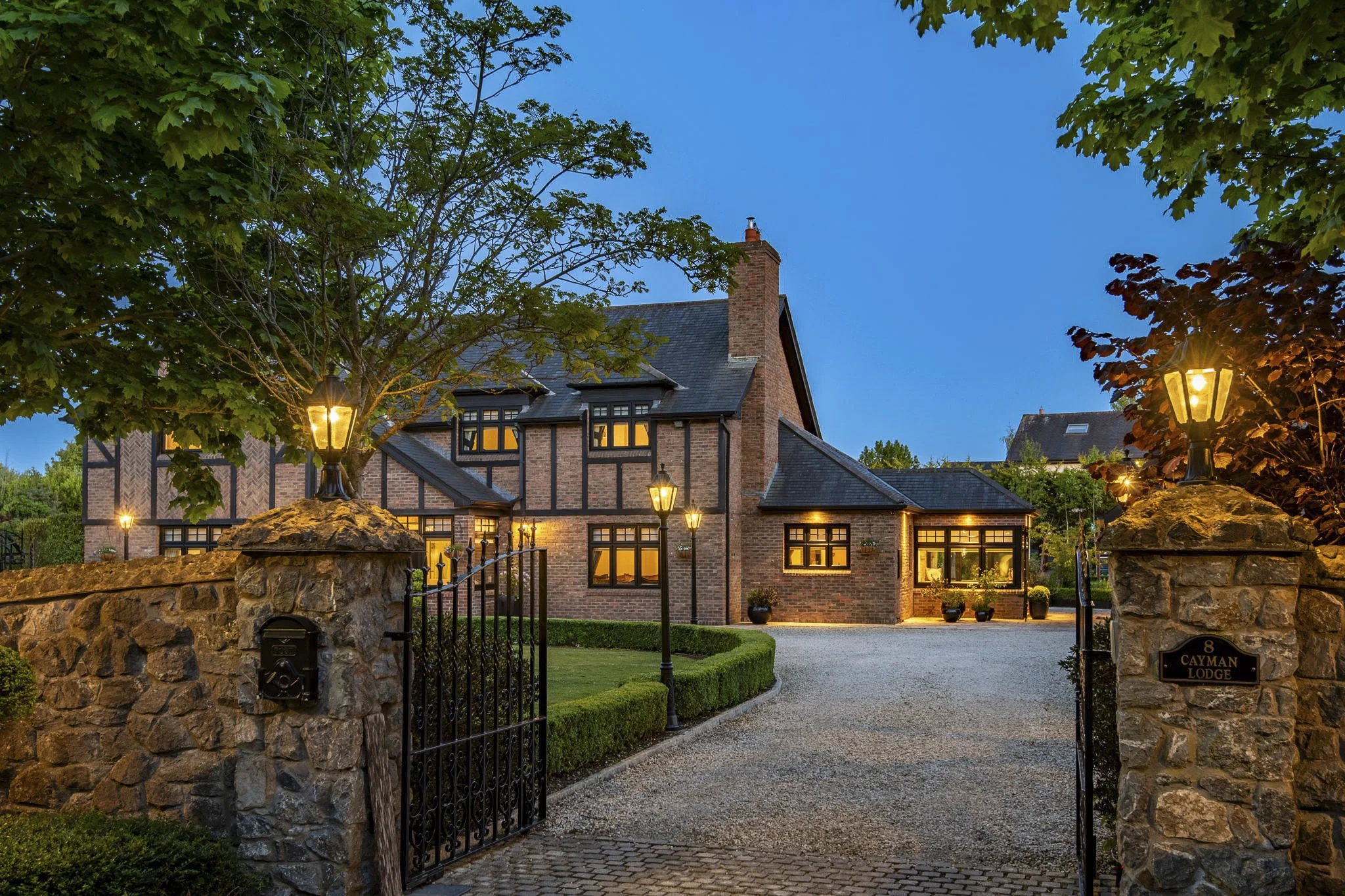 Completed home photographed at twilight with the lighting scheme lit
