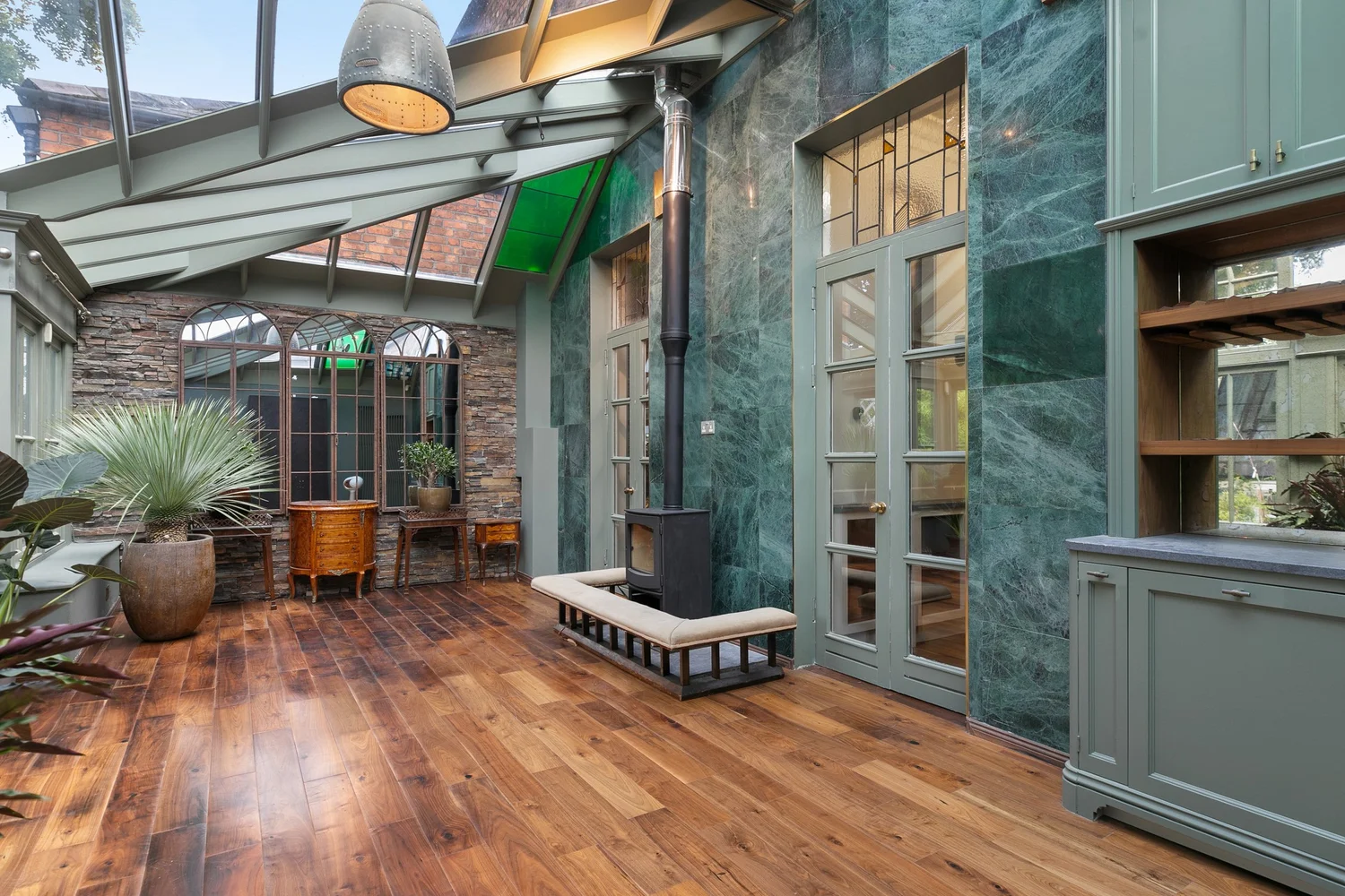 Glazed garden room interior, the kind of space a walkthrough video is built around